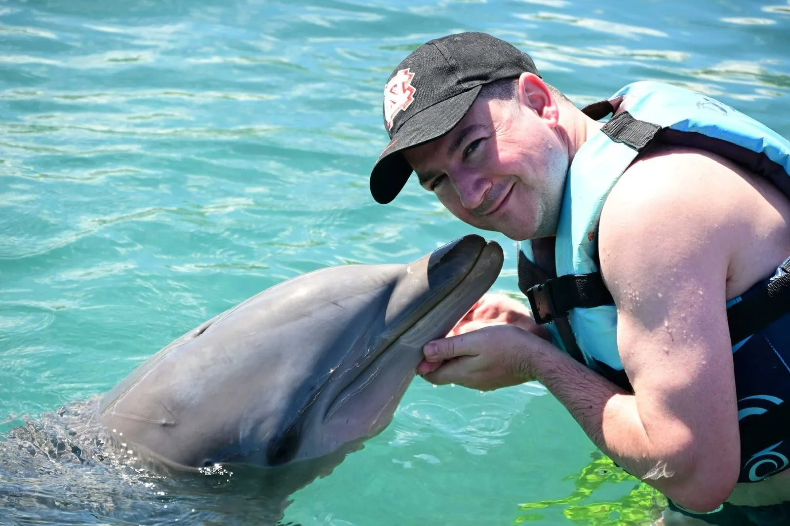 Matt meeting a dolphin while travelling